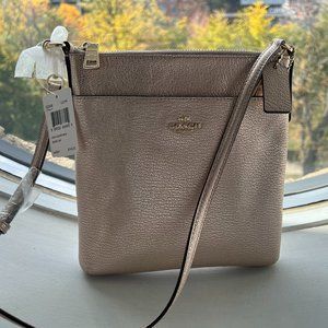 COACH soft leather cross-body bag, rose gold, with gold hardware.